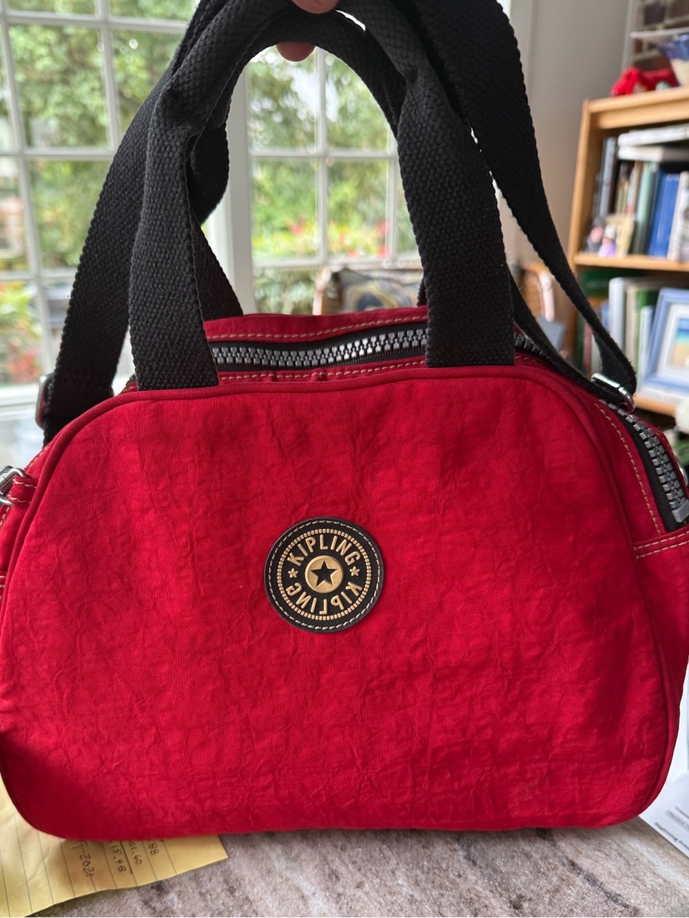 Kipling Red Satchel with Black Handles. Great bag. Lots of room. Great color